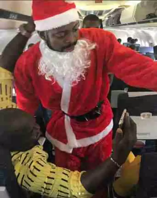 Basketmouth Dresses Up As Father Christmas, Surprises Fans Inside A Plane